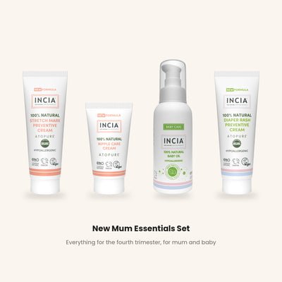 The four INCIA New Mum Essentials Set products lined up on a warm cream background