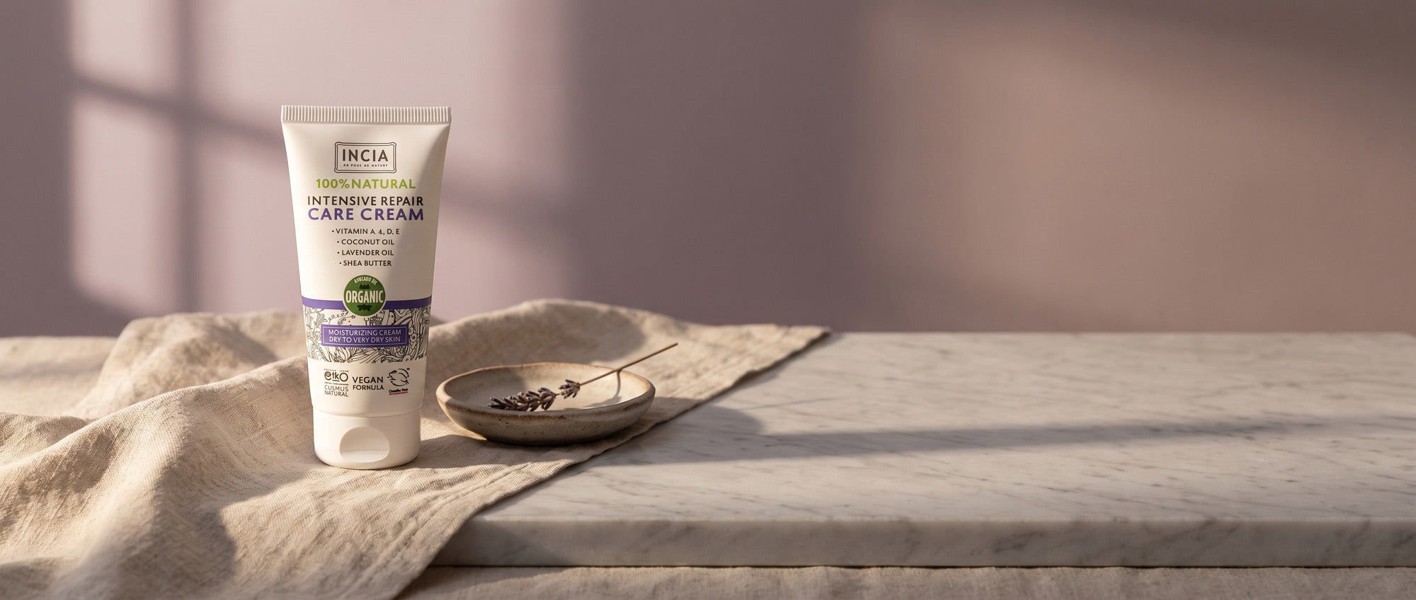 INCIA intensive repair care cream on marble with linen and lavender